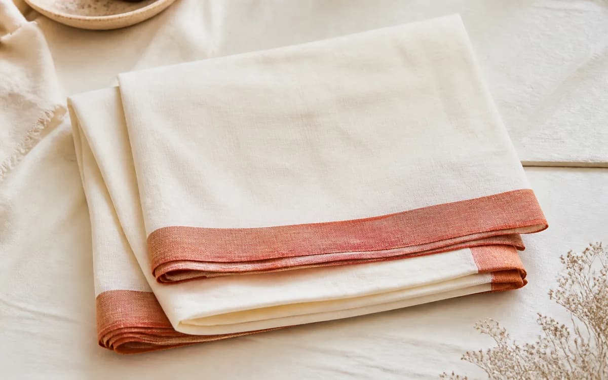 Editorial still life of beige suit fabric, representing ethnic sets & suits sourcing in Surat, Gujarat