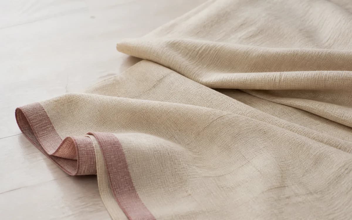 Editorial still life of block-print table linen, representing home textiles sourcing in Panipat, Haryana