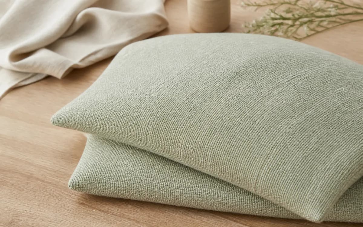 Editorial still life of coral home textiles, representing home textiles sourcing in Panipat, Haryana