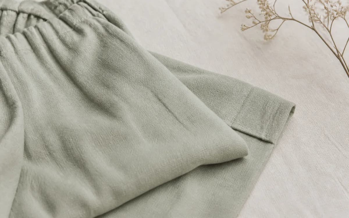 Editorial still life of beige workwear textile, representing uniforms & workwear sourcing in Jaipur, Rajasthan